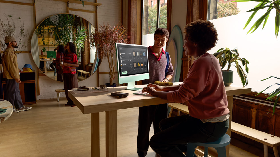 iMac is shown in the storefront of a business.