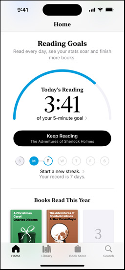 iPhone screen showing the Reading?Goals interface in the Books app. At the top, there is a progress ring. Below the progress ring is the weekly reading streak tracker. At the bottom is the Books?Read?This?Year section, which includes a row of two books, with an empty slot for a third